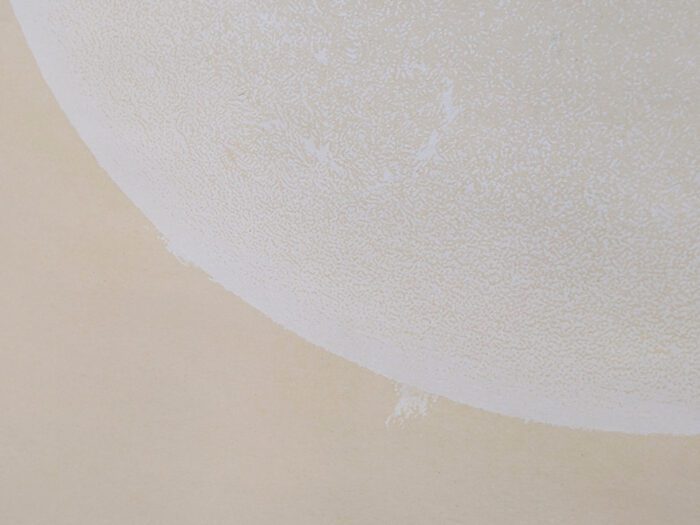 Echoes of the Sun (2022) by Sema Bekirovic and Jan-Pieter Karper — white A2 sheets printed in white ink that reveal a sun image over time when exposed to sunlight.