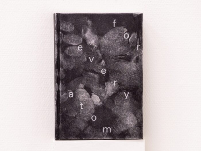 For Every Atom (2024) by Sema Bekirovic — artist book and museum guide treated with forensic powder to reveal traces of museum visitors.